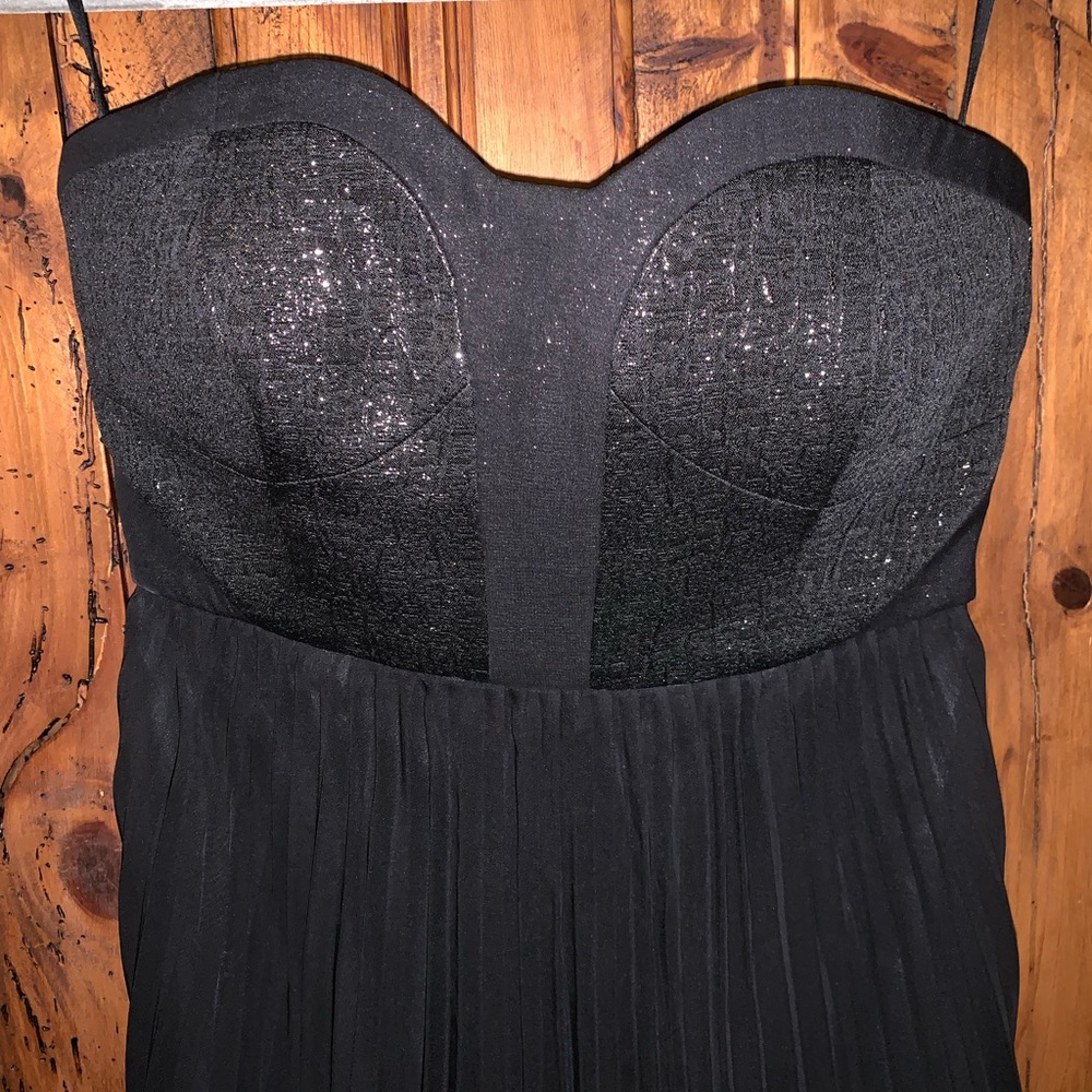 lbd with shimmery corset bodice and pleated skirt